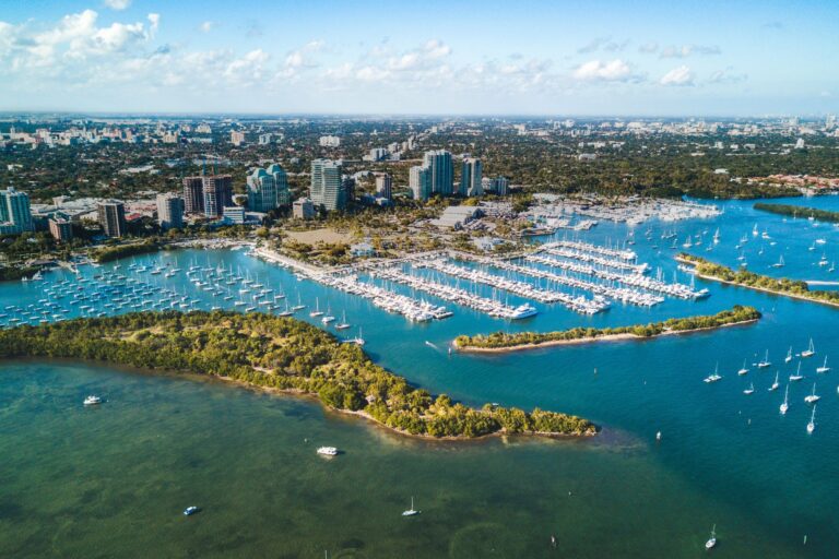 A view of the city from above, with boats docked in it.